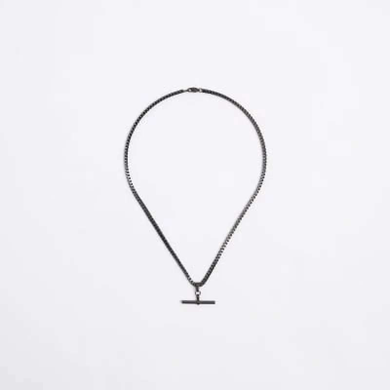 Black stainless steel T-bar Necklace sold by River Island