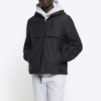 Black regular fit short raincoat jacket sold by River Island