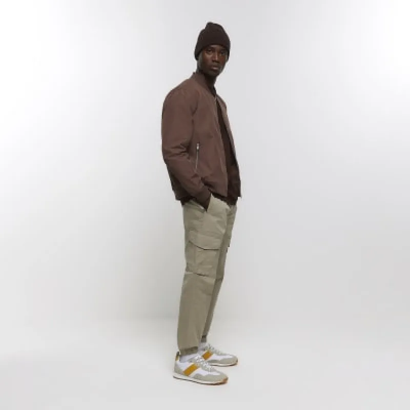 Beige regular fit cargo joggers sold by River Island