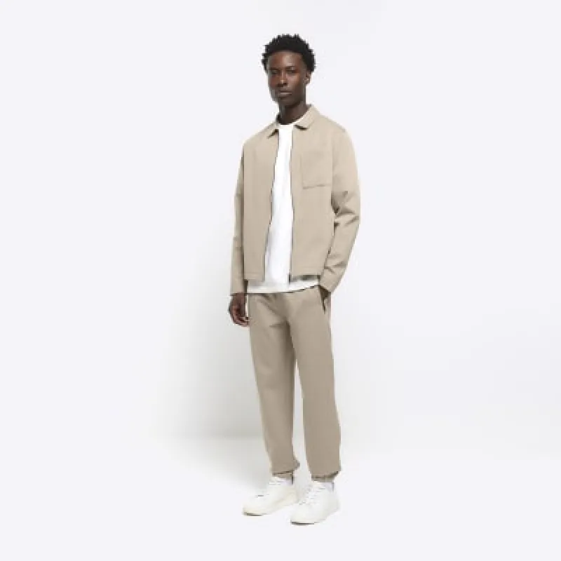 Stone slim fit textured smart joggers sold by River Island