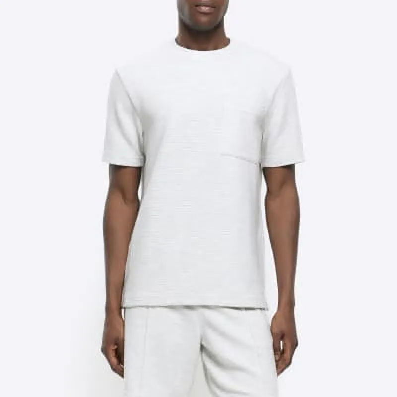 White regular fit textured pocket t-shirt sold by River Island