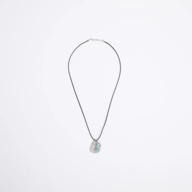 Silver colour charm necklace sold by River Island