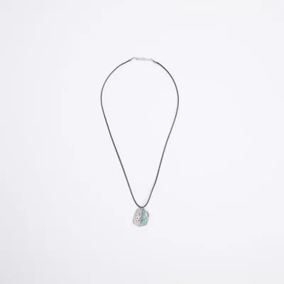 Silver colour charm necklace sold by River Island