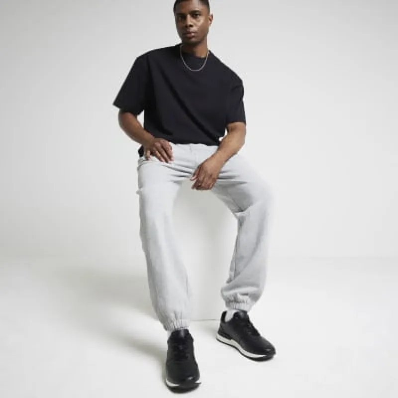 Black plain trainers sold by River Island