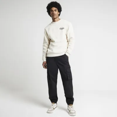 Ecru regular fit gothic graphic sweatshirt sold by River Island