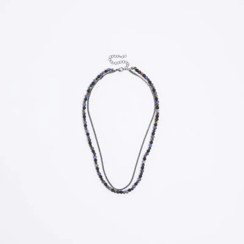 Blue beaded multirow necklace sold by River Island