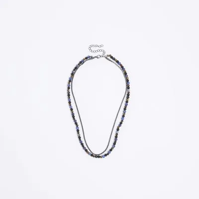 Blue beaded multirow necklace sold by River Island