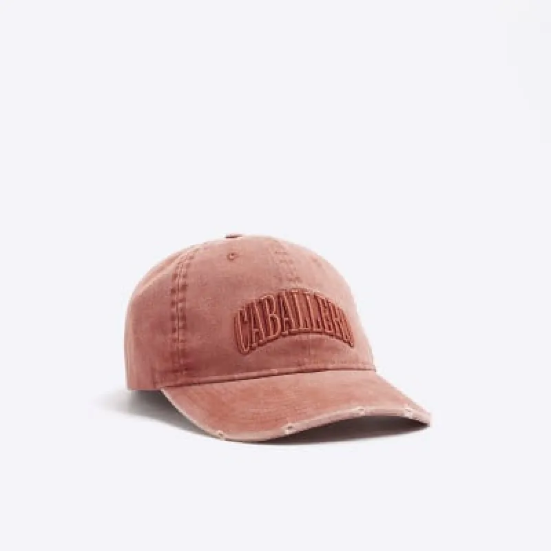 Washed rust embroidered cap sold by River Island