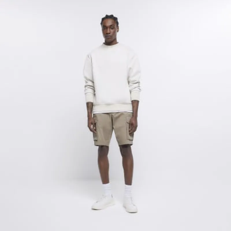 Beige regular fit utility cargo shorts sold by River Island