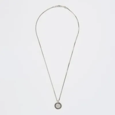 Silver colour coin pendant necklace sold by River Island