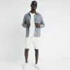 Beige slim fit cargo shorts sold by River Island