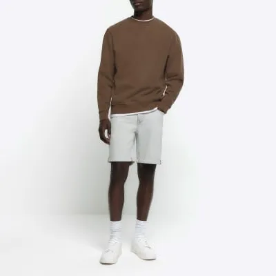 Blue slim fit turned hem denim shorts sold by River Island