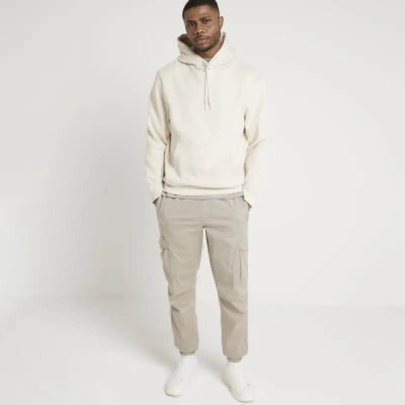 Stone slim fit cuffed cargo trousers sold by River Island