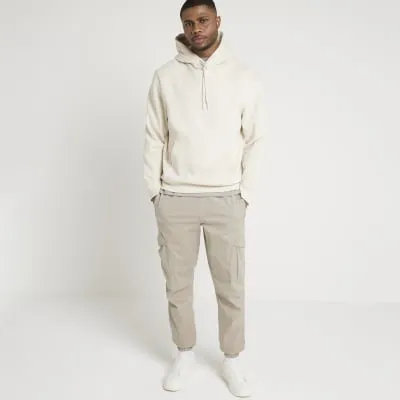 Stone slim fit cuffed cargo trousers sold by River Island