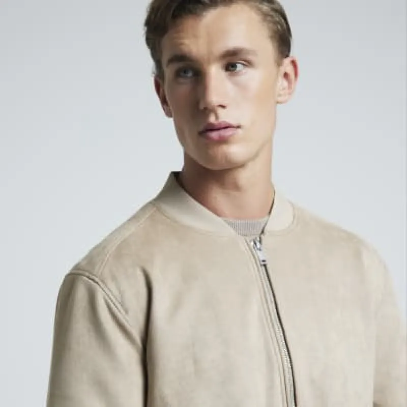 Stone regular fit suedette bomber jacket sold by River Island