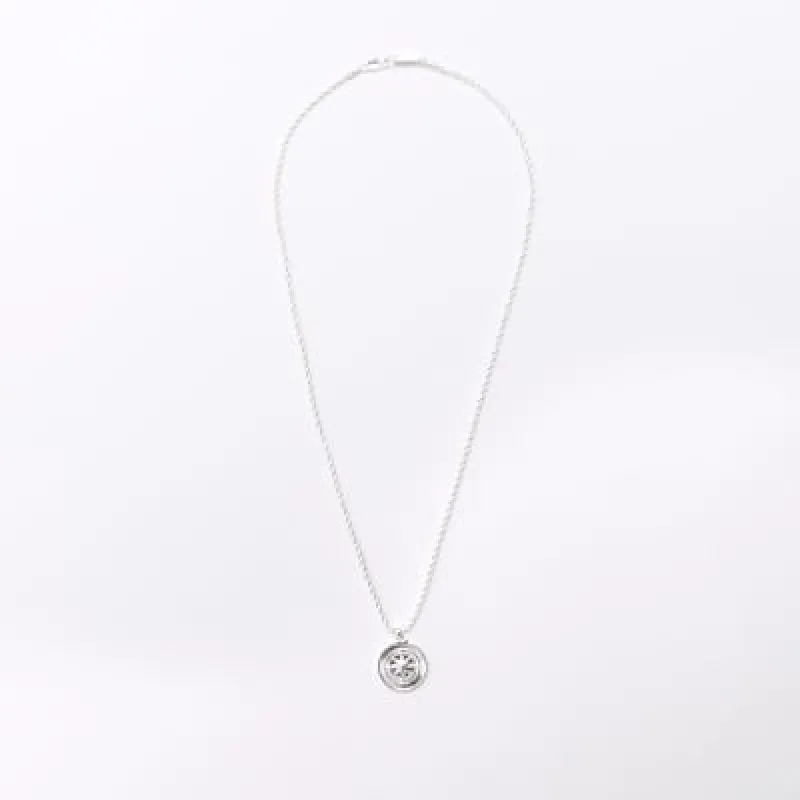 Silver compass necklace sold by River Island