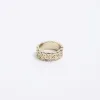 Gold colour textured ring sold by River Island