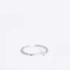 Silver colour cross bracelet sold by River Island