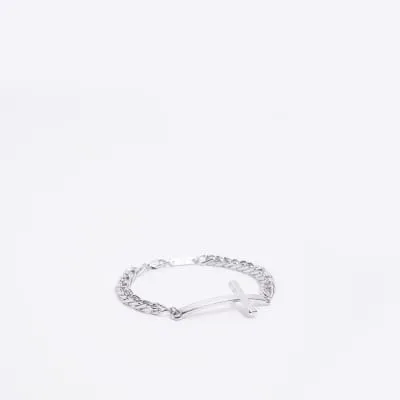 Silver colour cross bracelet sold by River Island