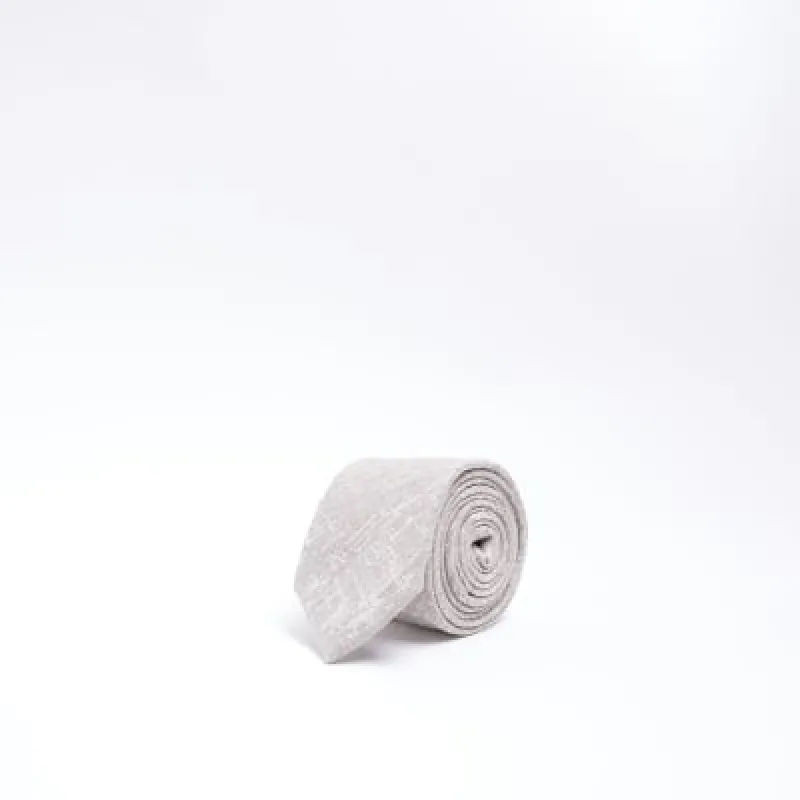 Beige textured tie sold by River Island