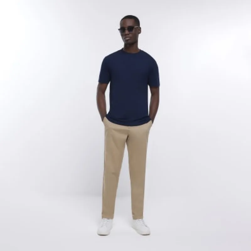 Brown slim fit casual chino trousers sold by River Island