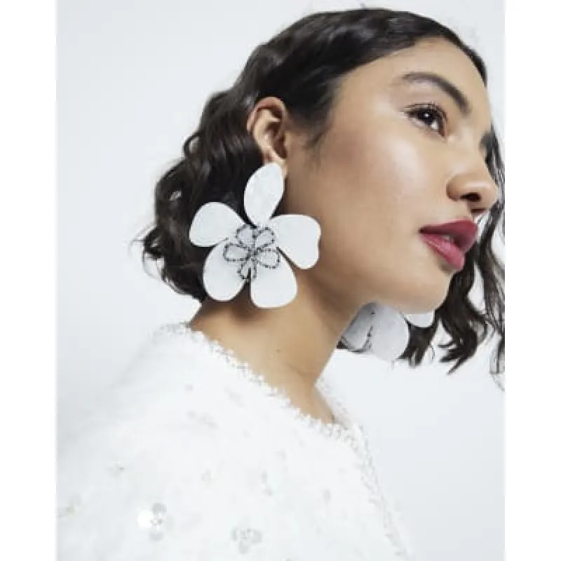White Flower Resin Earrings sold by River Island