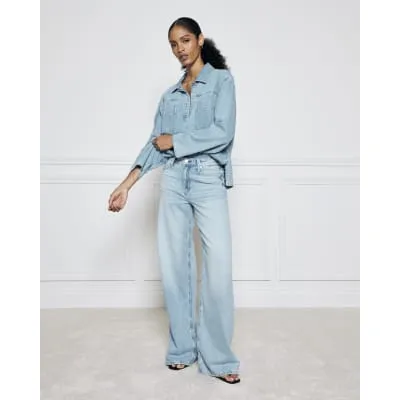 Blue mid rise wide leg jeans sold by River Island