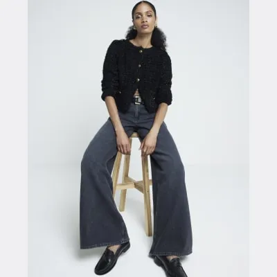 Black mid rise wide leg jeans sold by River Island