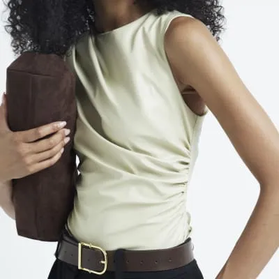 Beige faux leather drape top sold by River Island