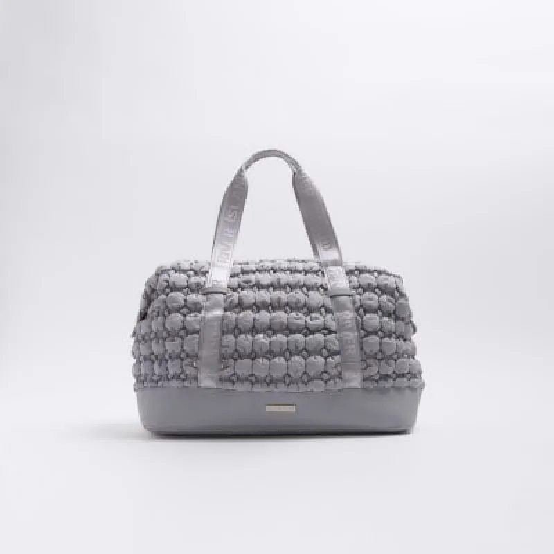 Grey quilted texture travel bag sold by River Island