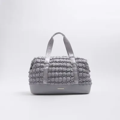 Grey quilted texture travel bag sold by River Island