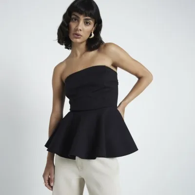 Black bandeau peplum top sold by River Island