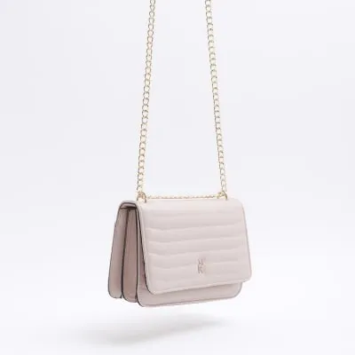 Pink quilted chain strap shoulder bag sold by River Island