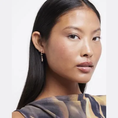 Gold heart hoop and stud earrings multipack sold by River Island