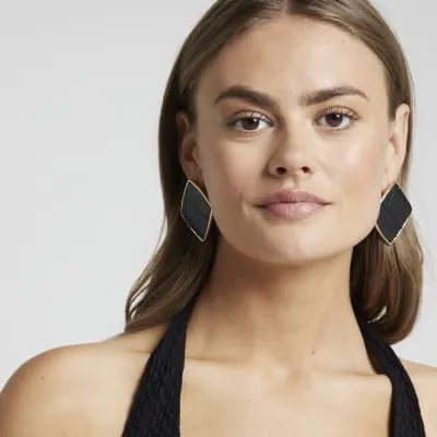 Black croc embossed large stud earrings sold by River Island