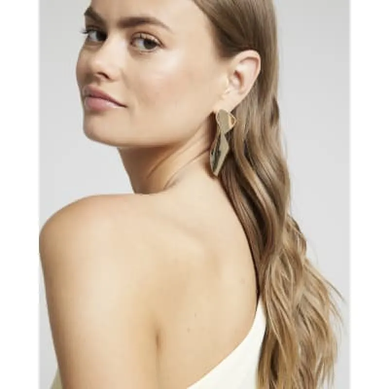Gold twisted drop earrings sold by River Island