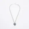 Silver heart pendant chain necklace sold by River Island