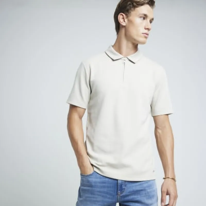 Stone slim fit textured half zip polo sold by River Island