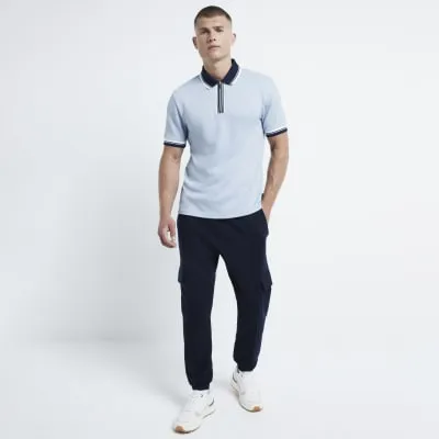 Blue slim fit textured tipped half zip polo sold by River Island