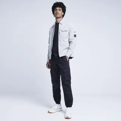 Black regular fit cargo trousers sold by River Island