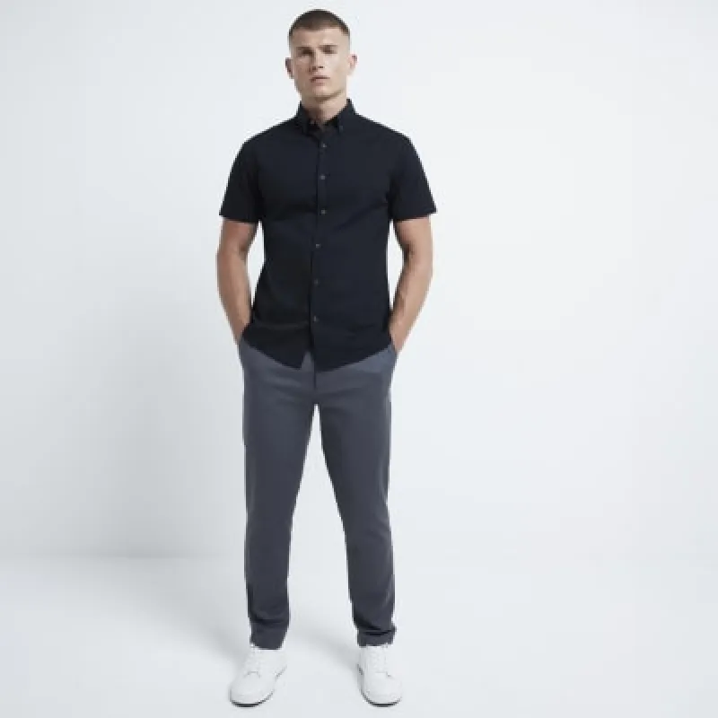 Black muscle fit stretch textured smart shirt sold by River Island
