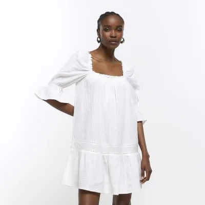 Cream smock mini dress sold by River Island