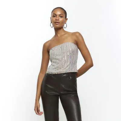 Gold sequin bandeau top sold by River Island