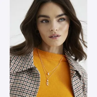 Gold Layered Fish Pearl Necklace sold by River Island