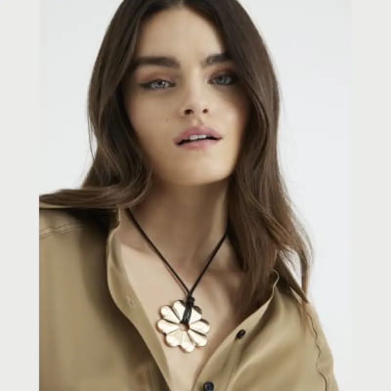 Black Gold Flower Pendant Necklace sold by River Island