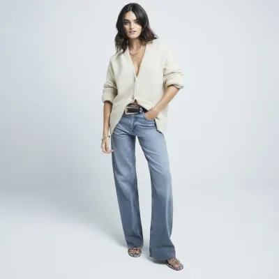 Blue mid rise wide leg jeans sold by River Island
