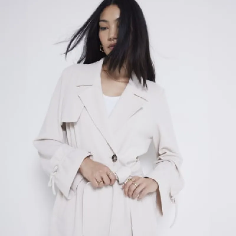 Beige tie cuff belted trench coat sold by River Island