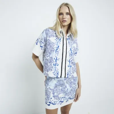 Blue floral lace trim crop shirt sold by River Island