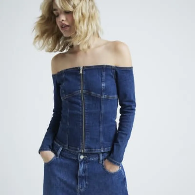 Blue denim bardot zip up top sold by River Island