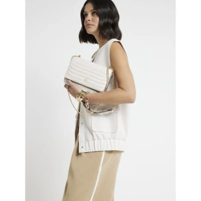 Cream quilted chain shoulder bag sold by River Island